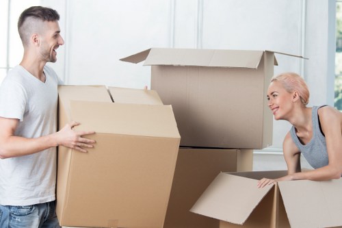 Specialist movers handling a grand piano move across North West London
