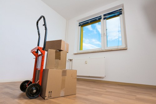 Loading household boxes and furniture into a van for an Edgware move