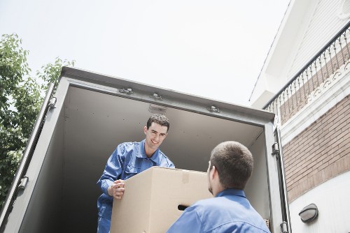 Local office relocation team handling business furniture and boxes